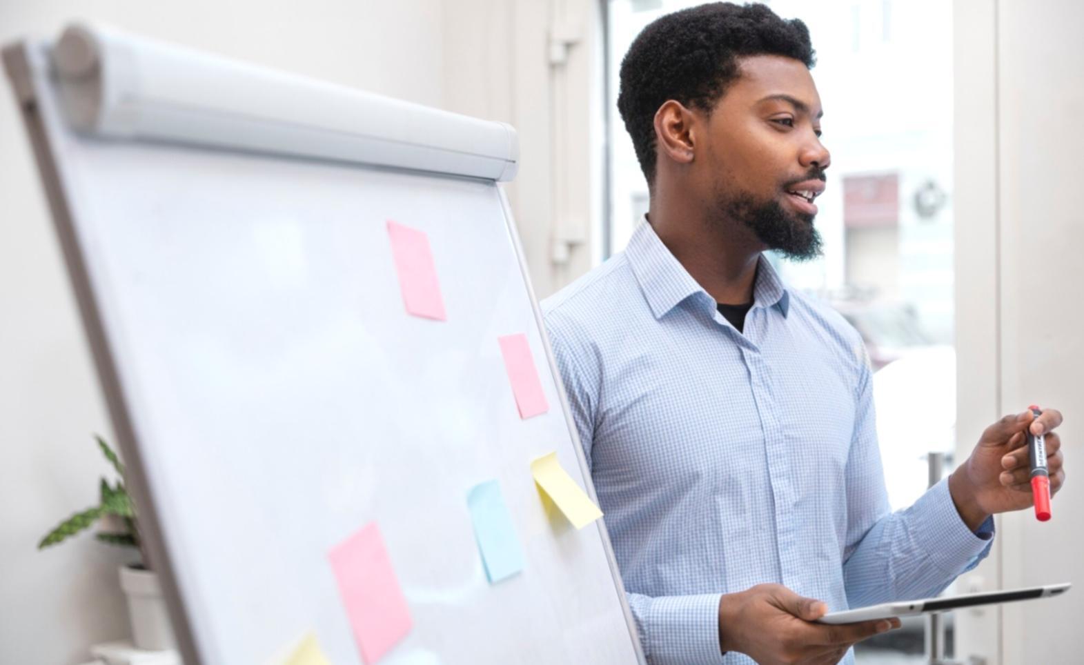 Professional trading desk setup with multiple screens showing different market timeframes and analysis tools